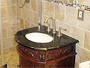 Glass shower door and vanity installed.